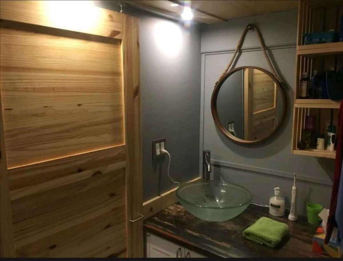bathroom of fully equipped tiny home has all the standard fittings