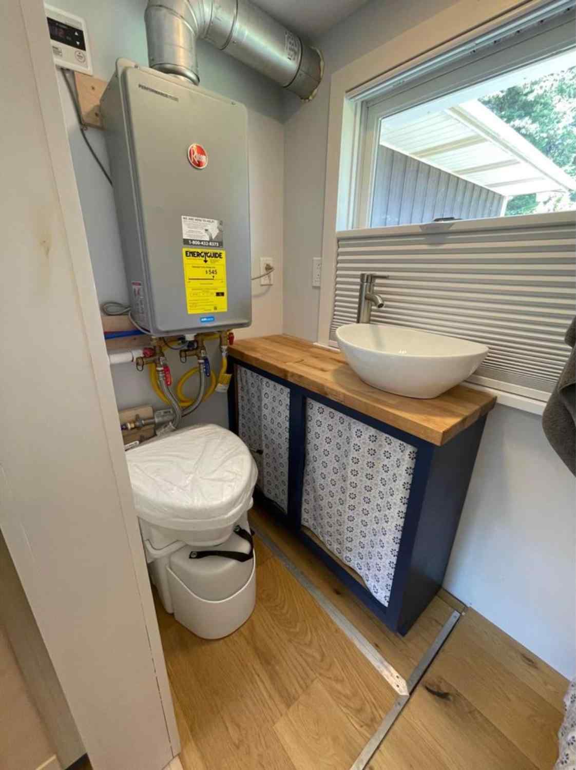 bathroom of fully offgrid home has a composting toilet 